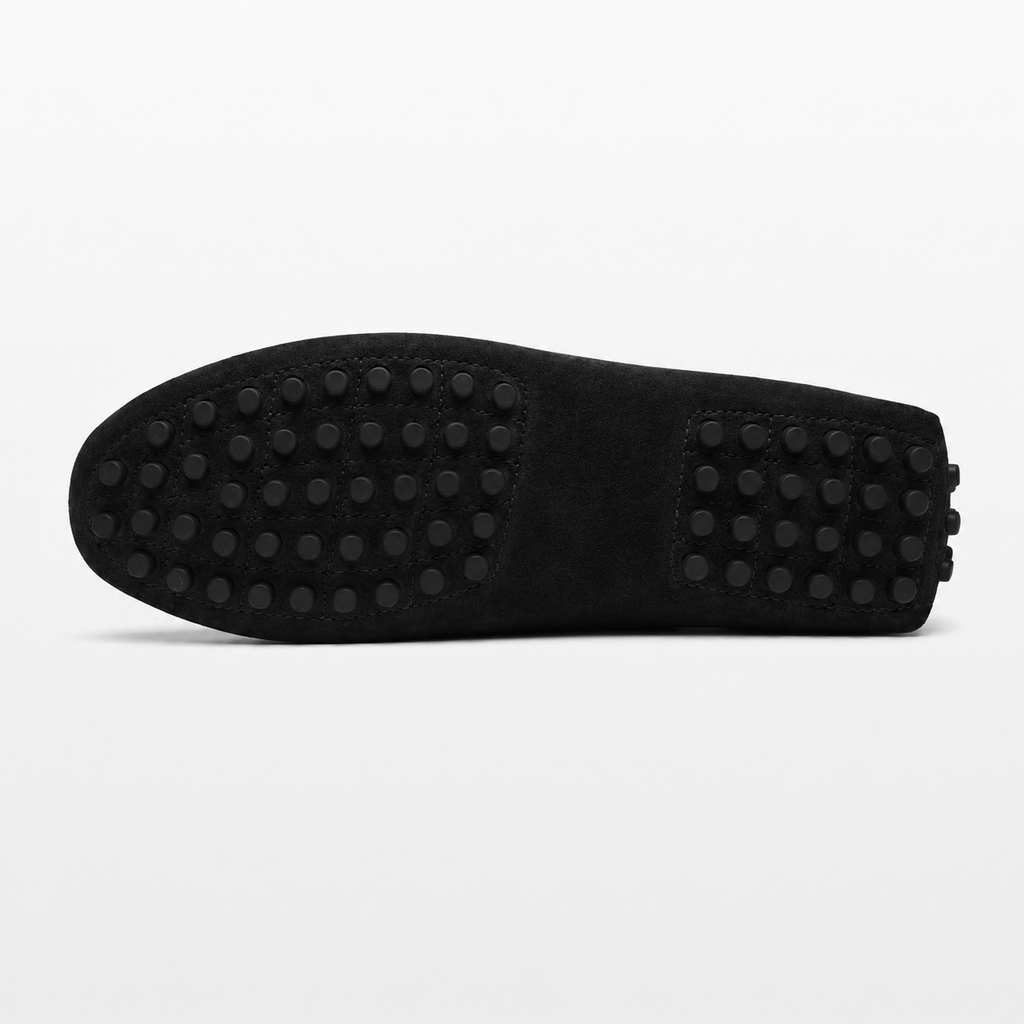 Black shoe sole with textured pattern on a white background