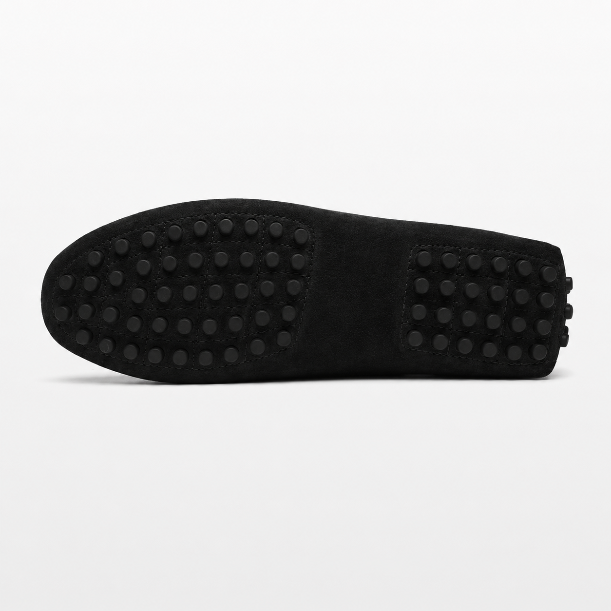 Black shoe sole with textured pattern on a white background