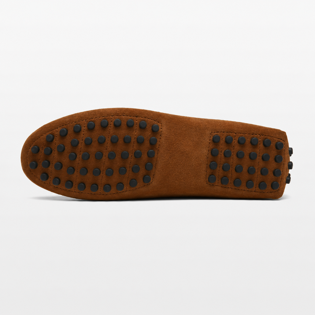 Brown shoe sole with black studs on a white background
