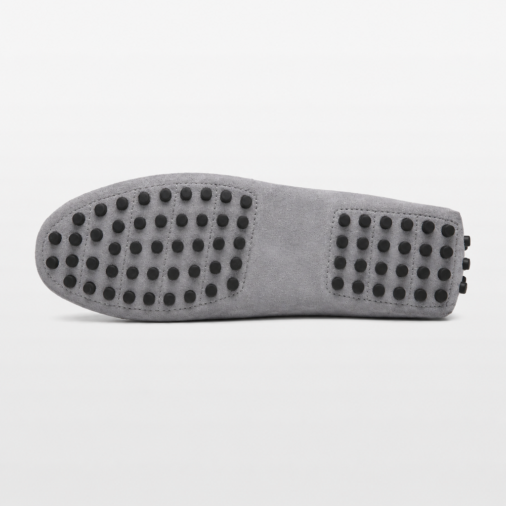 Close-up of a shoe sole with textured pattern on a white background