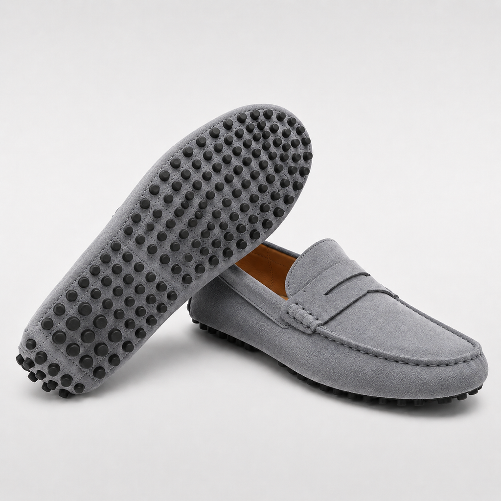 Gray loafers with textured sole on a light gray background