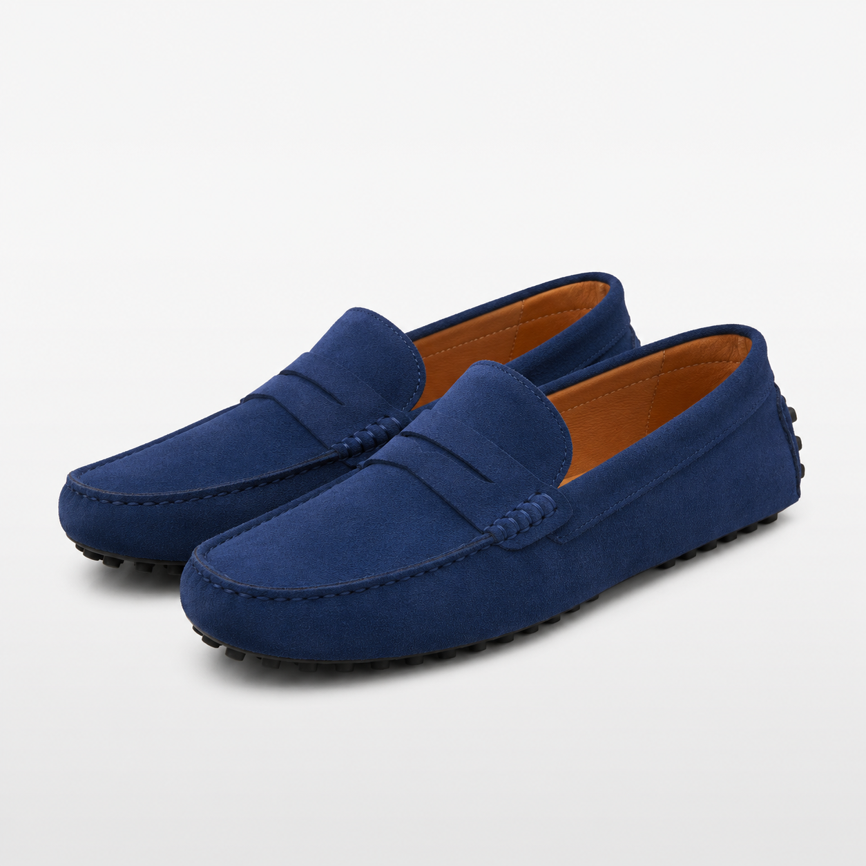 Pair of blue loafers on a light gray background