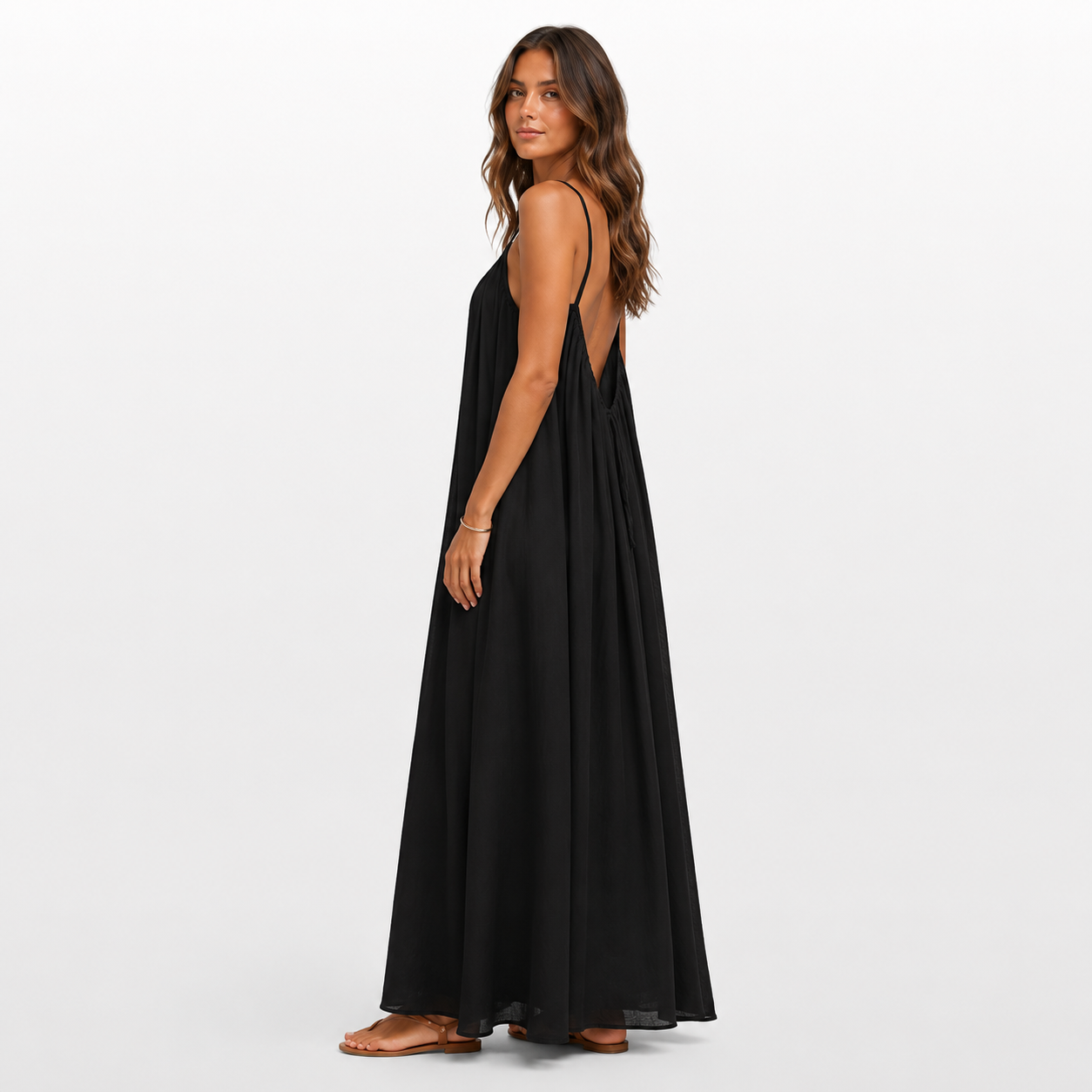 Woman wearing a black sleeveless dress on a white background