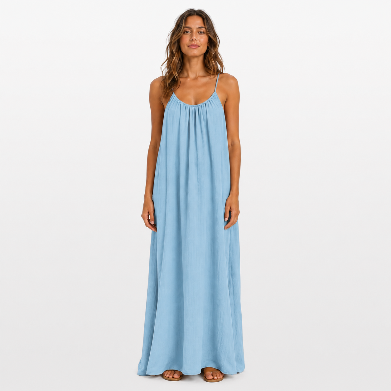 Woman wearing a light blue maxi dress on a white background