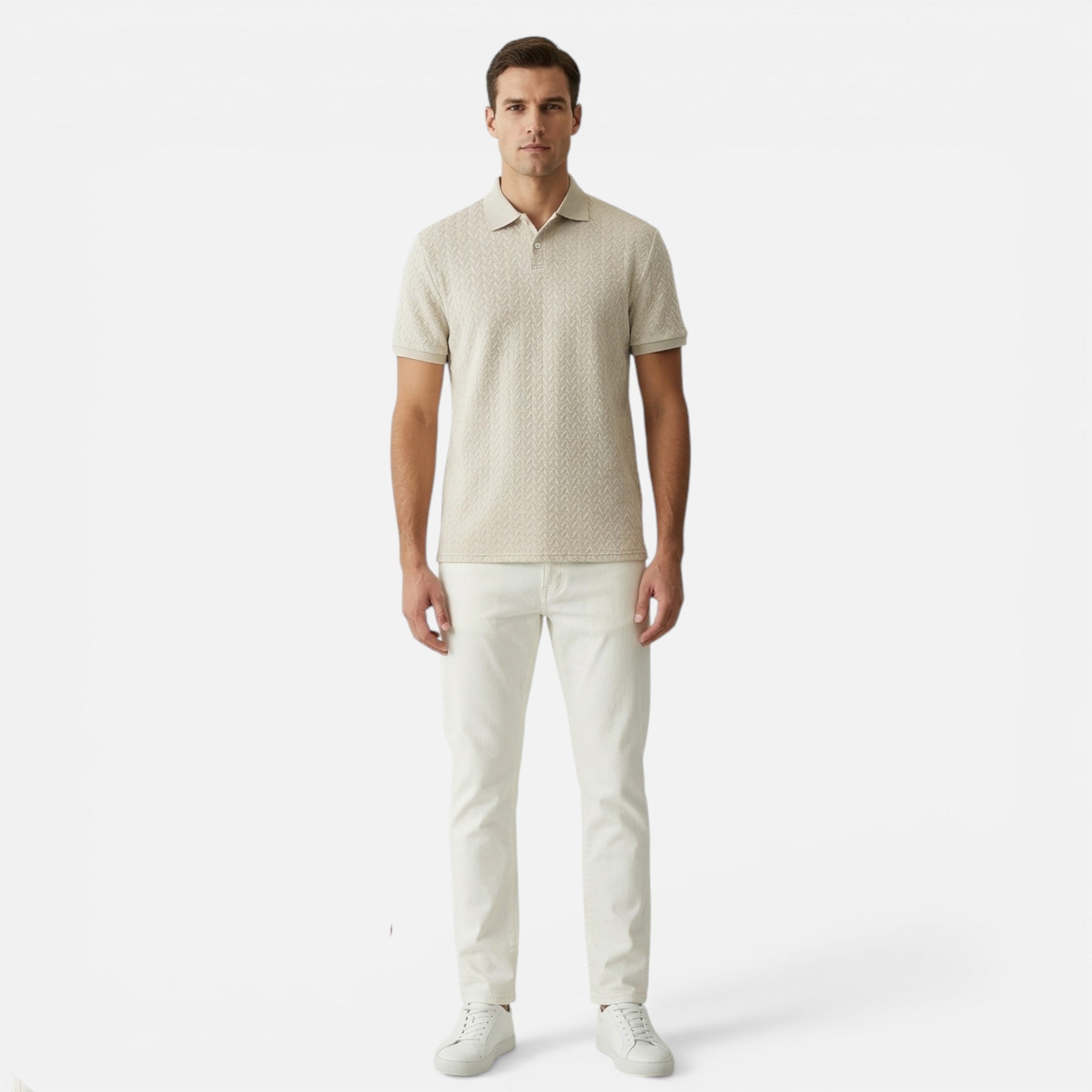 Man wearing a beige patterned polo shirt and white pants on a white background