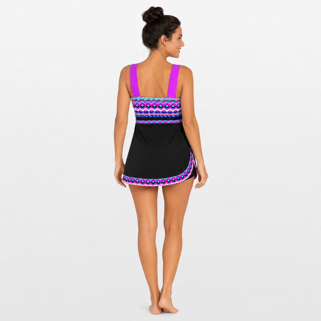 Woman wearing a black and purple patterned swimsuit on a white background