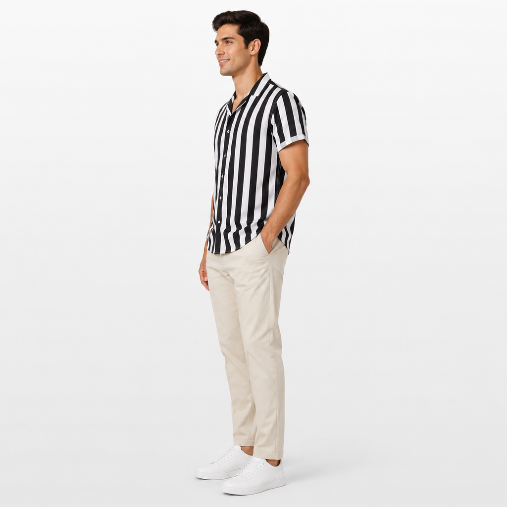 Man wearing a black and white striped shirt and beige pants on a white background