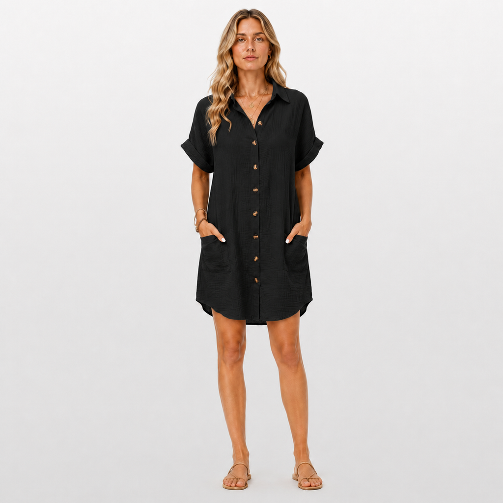 Woman wearing a black dress with short sleeves on a white background