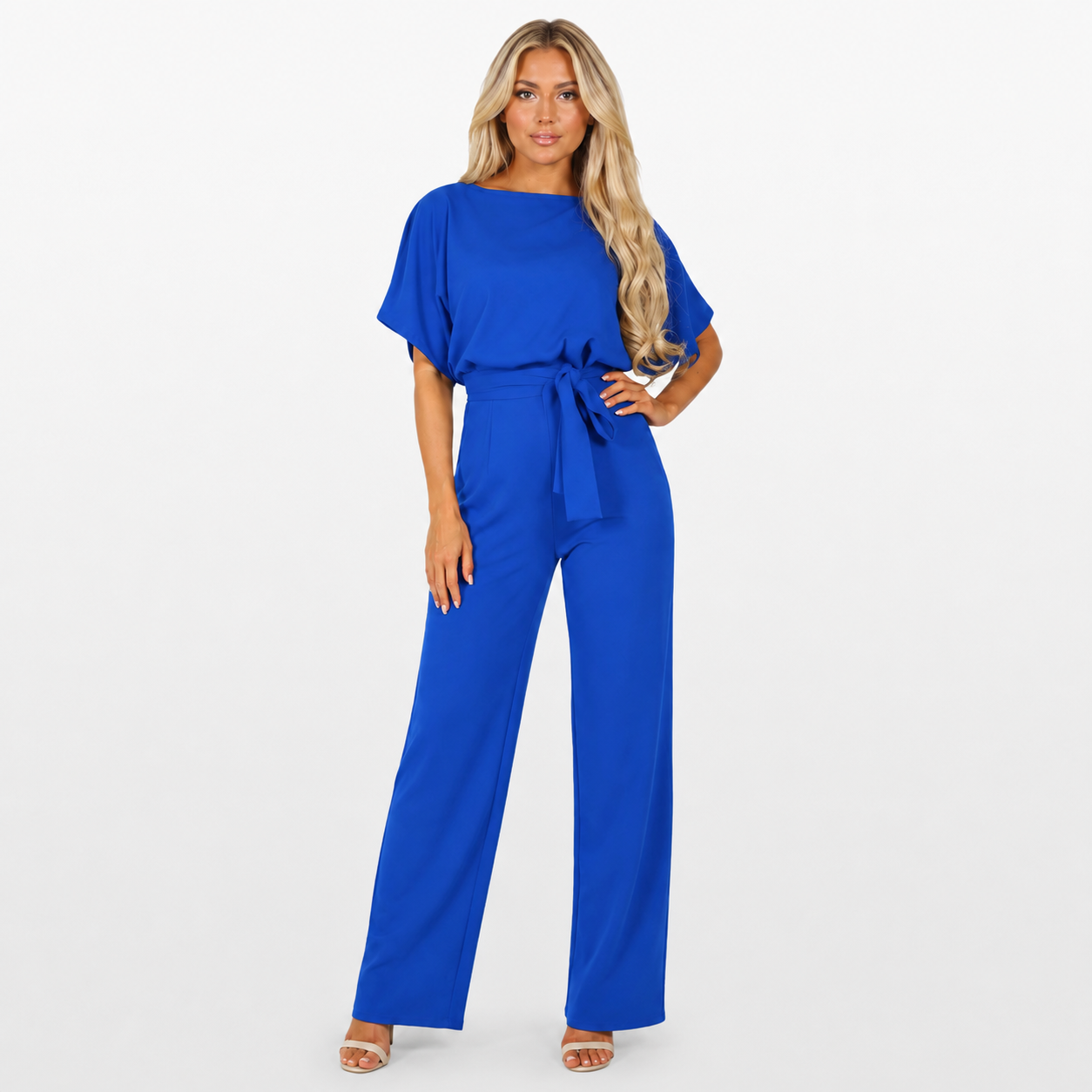 Woman wearing a blue jumpsuit on a white background