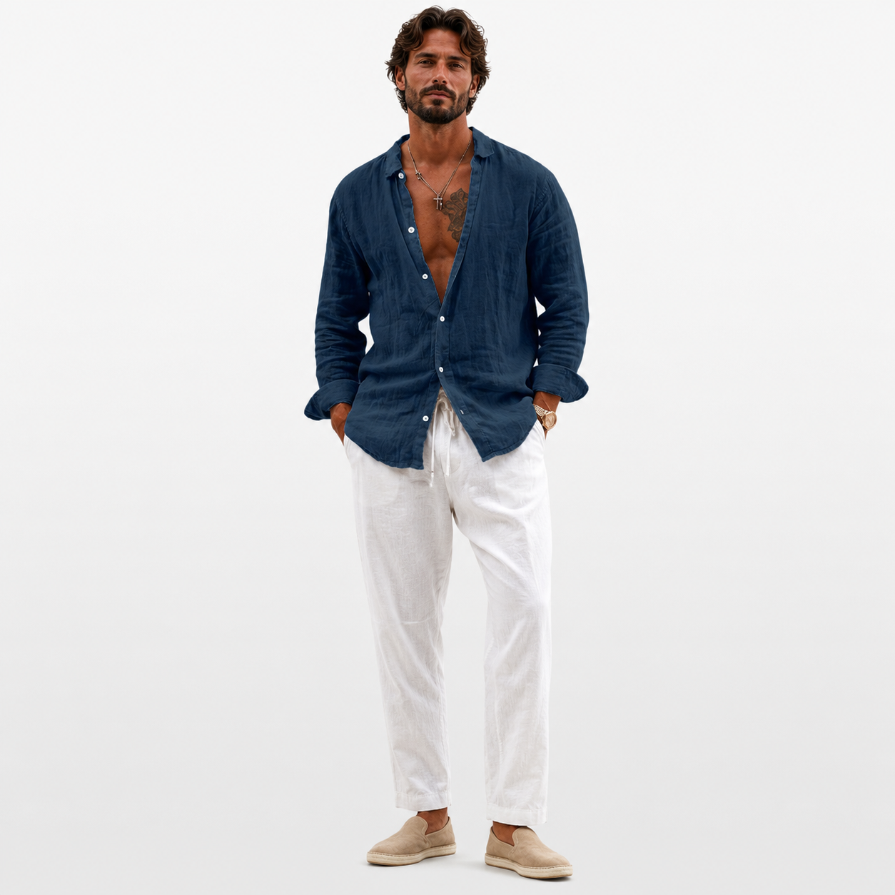 Man wearing a blue shirt and white pants on a white background