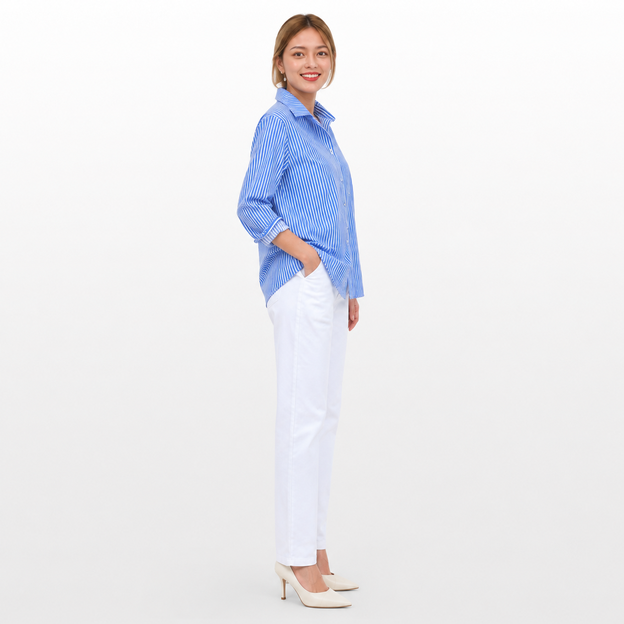 Woman wearing a blue striped shirt and white pants on a white background