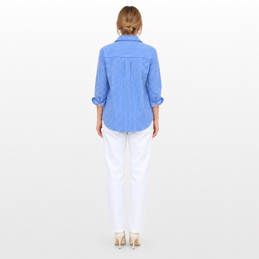 Woman wearing a blue striped shirt and white pants on a white background