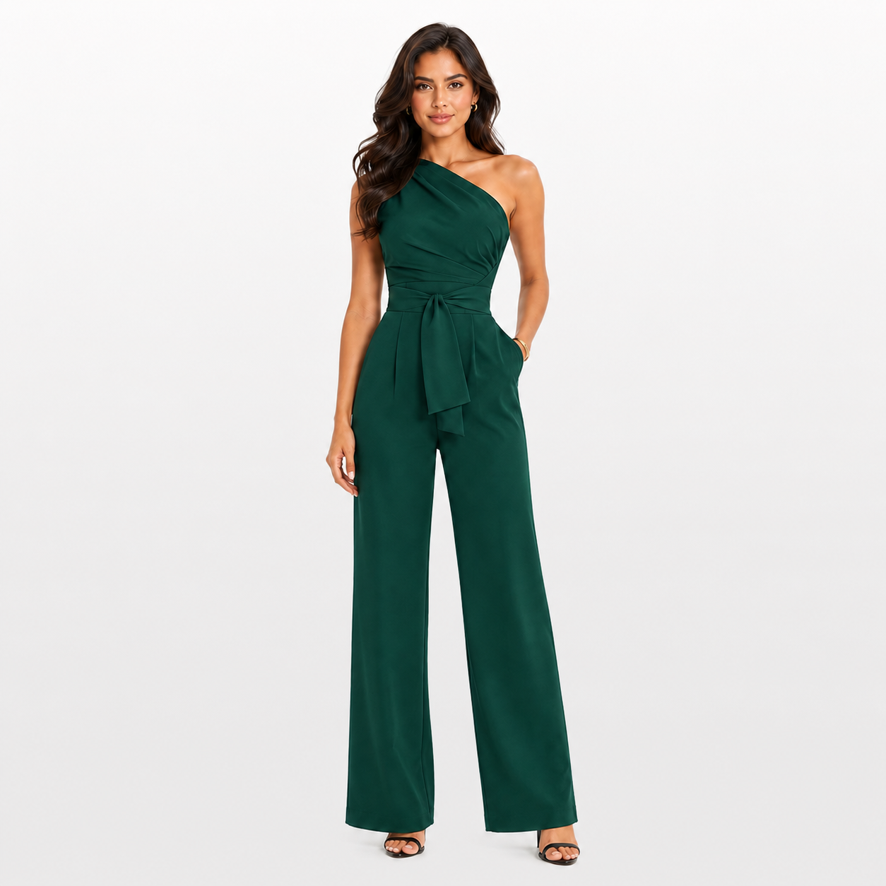 Woman wearing a green one-shoulder jumpsuit on a white background