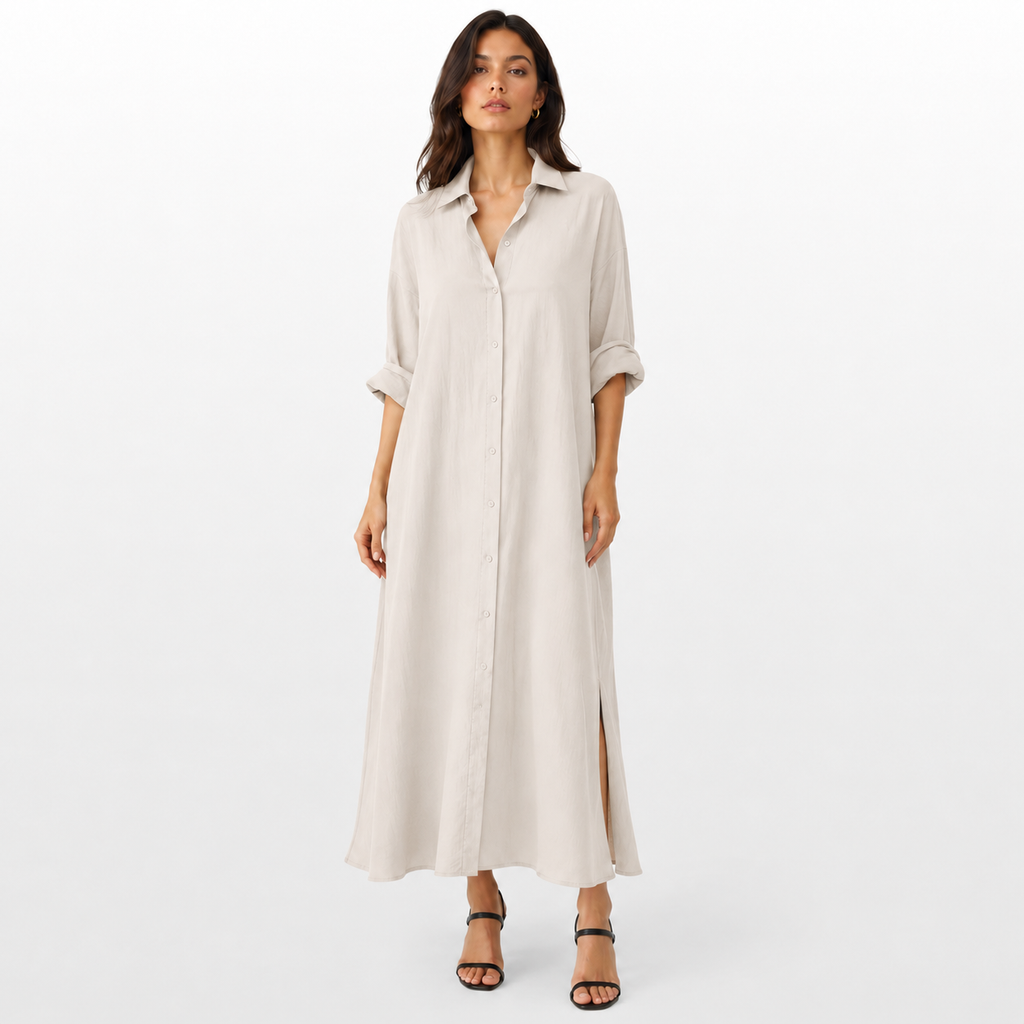 Woman wearing a long beige dress on a white background