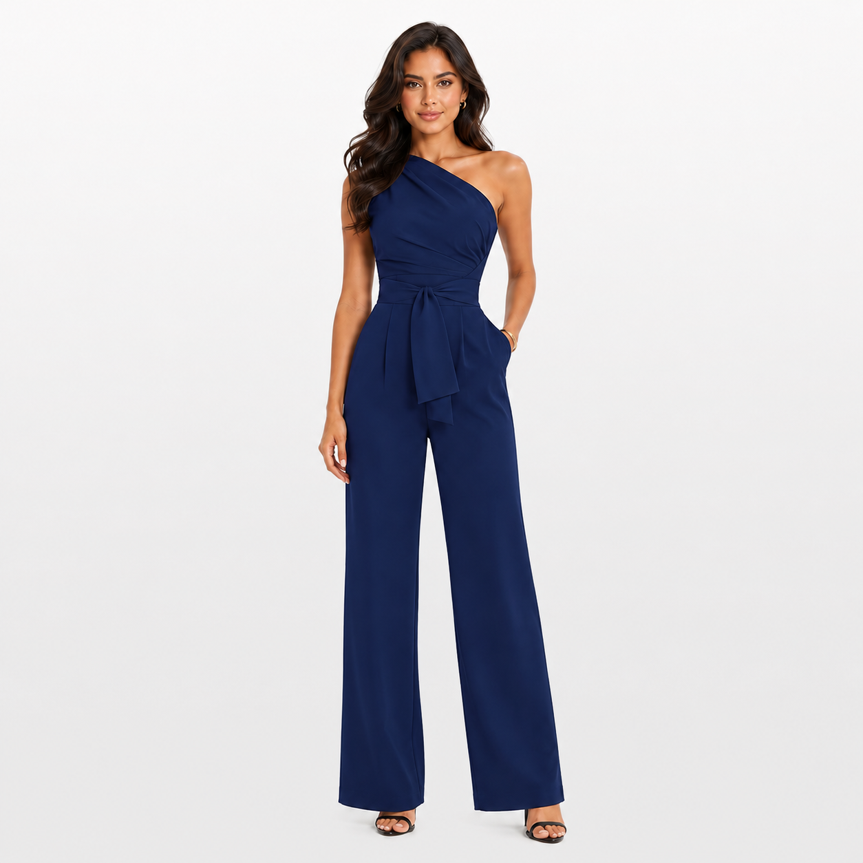 Woman wearing a navy blue one-shoulder jumpsuit on a white background