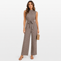 Woman wearing a patterned jumpsuit on a white background