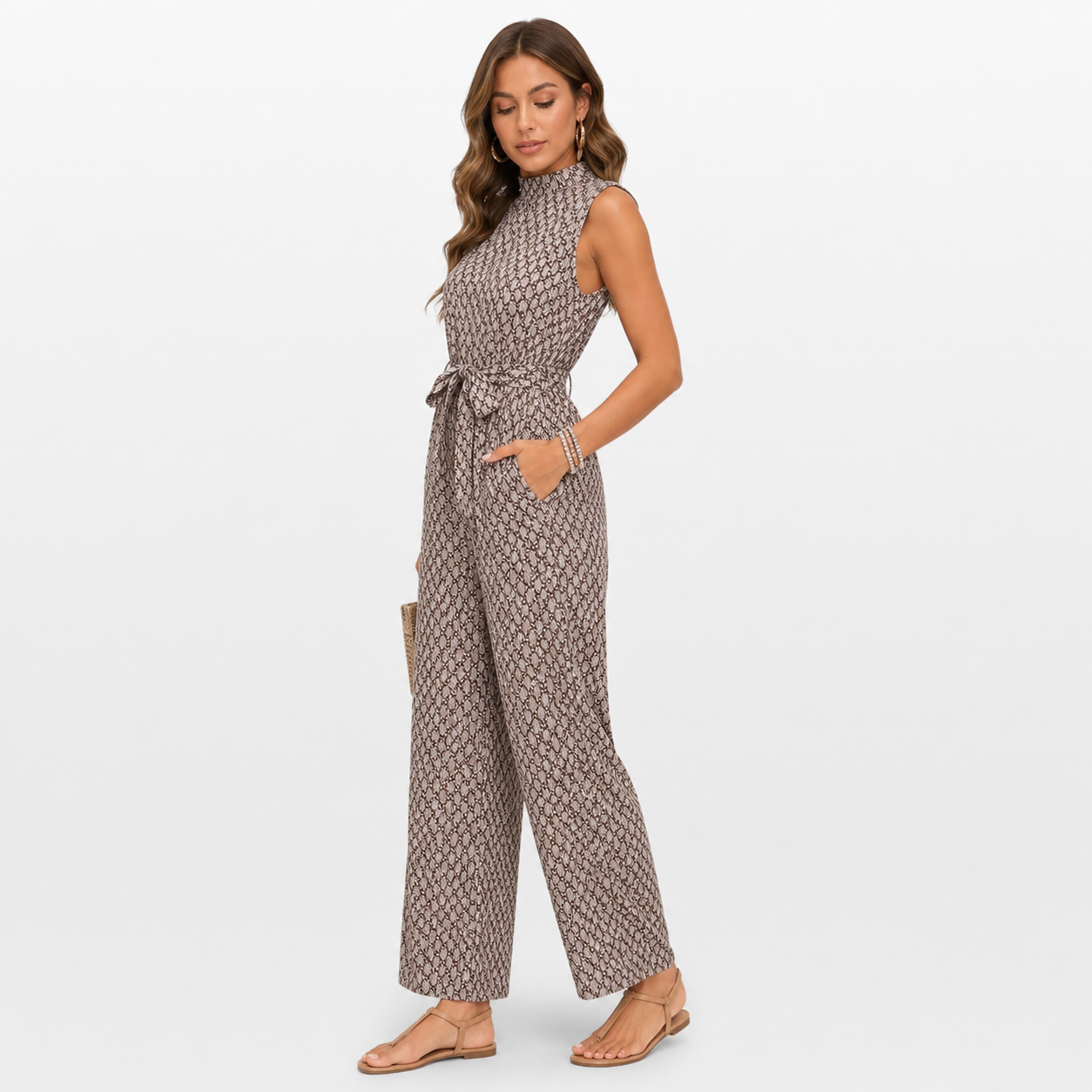 Woman wearing a patterned jumpsuit on a white background