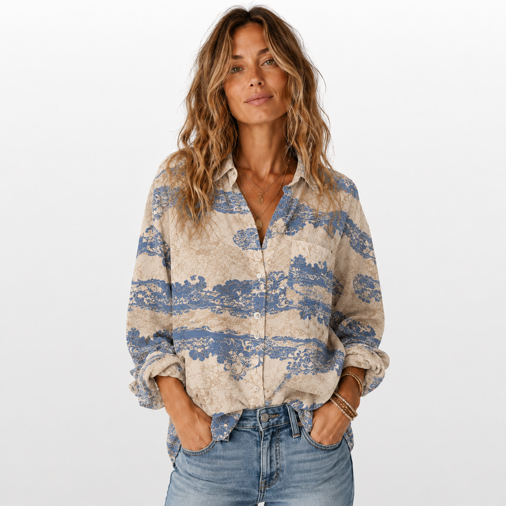 Woman wearing a patterned shirt and jeans on a white background