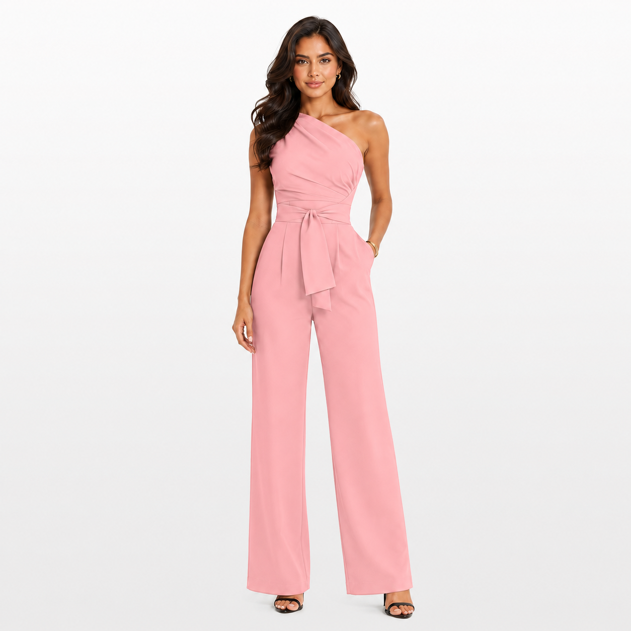 Woman wearing a pink one-shoulder jumpsuit on a white background