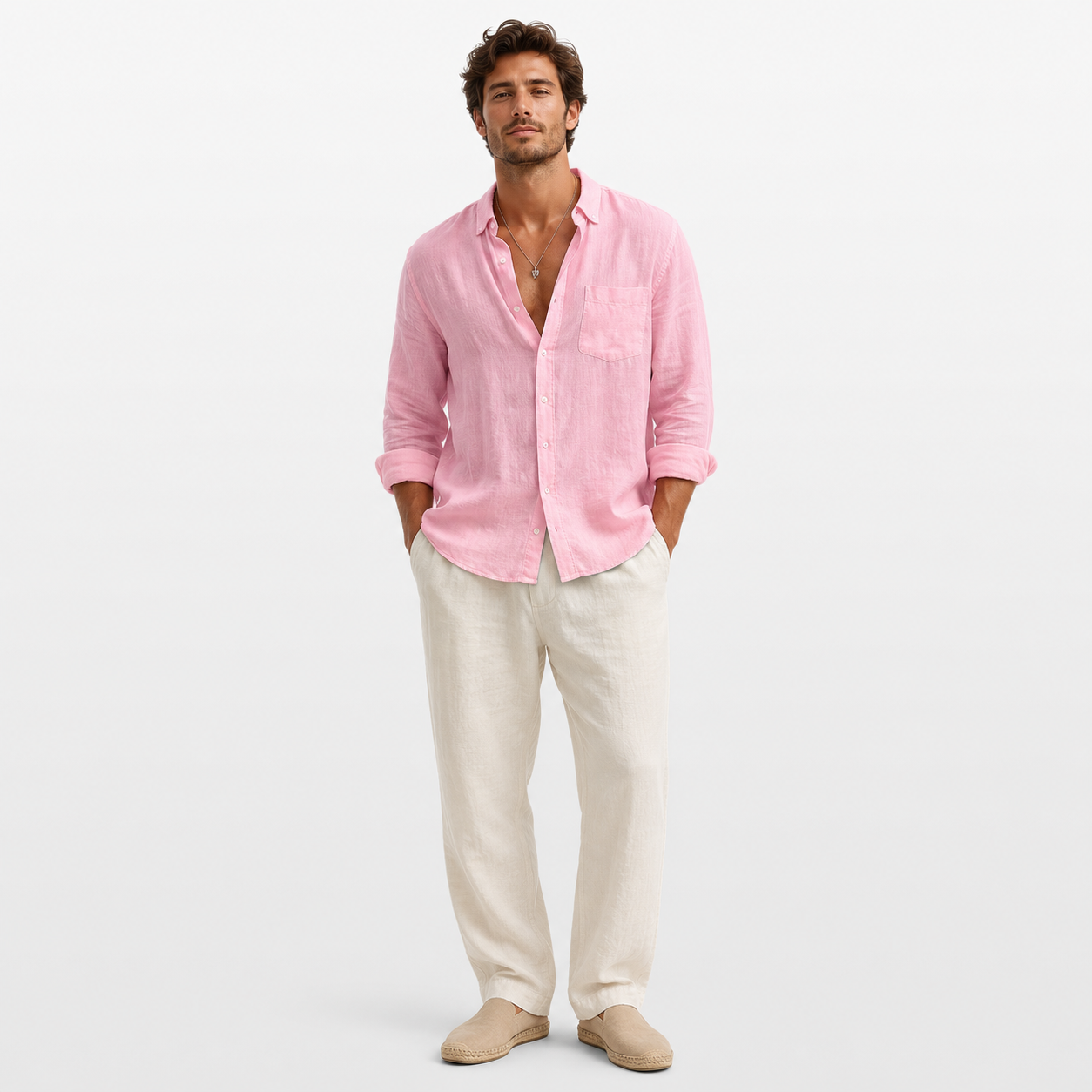 Man wearing a pink shirt and beige pants on a white background