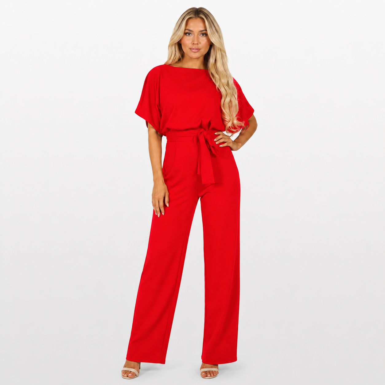 Woman wearing a red jumpsuit on a white background