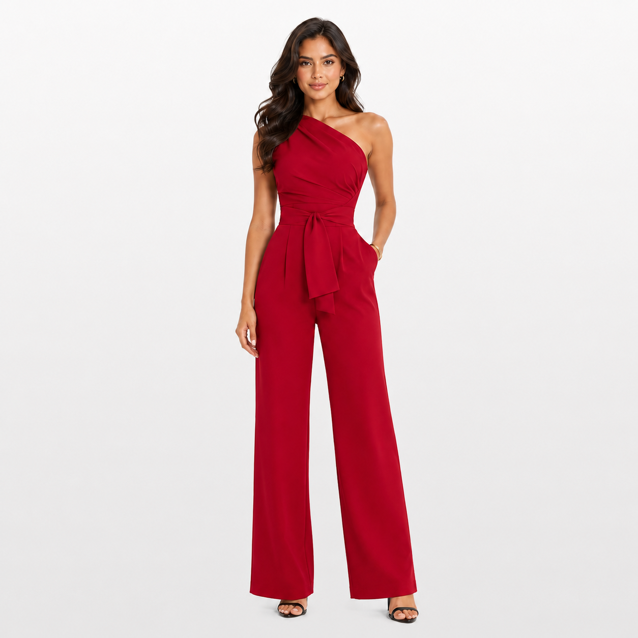 Woman wearing a red one-shoulder jumpsuit on a white background