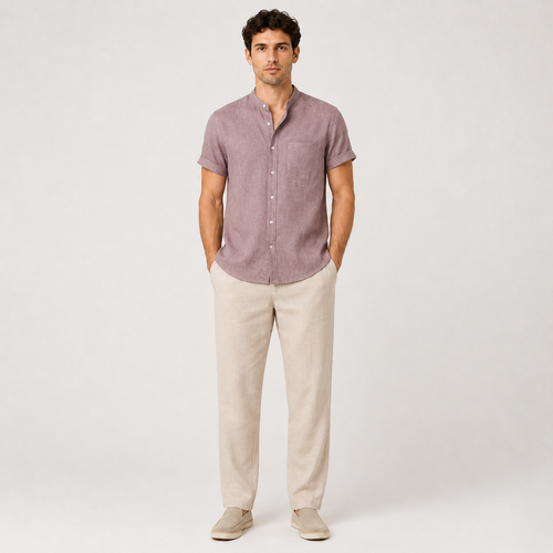 Man wearing a short-sleeve button-up shirt and beige pants on a white background