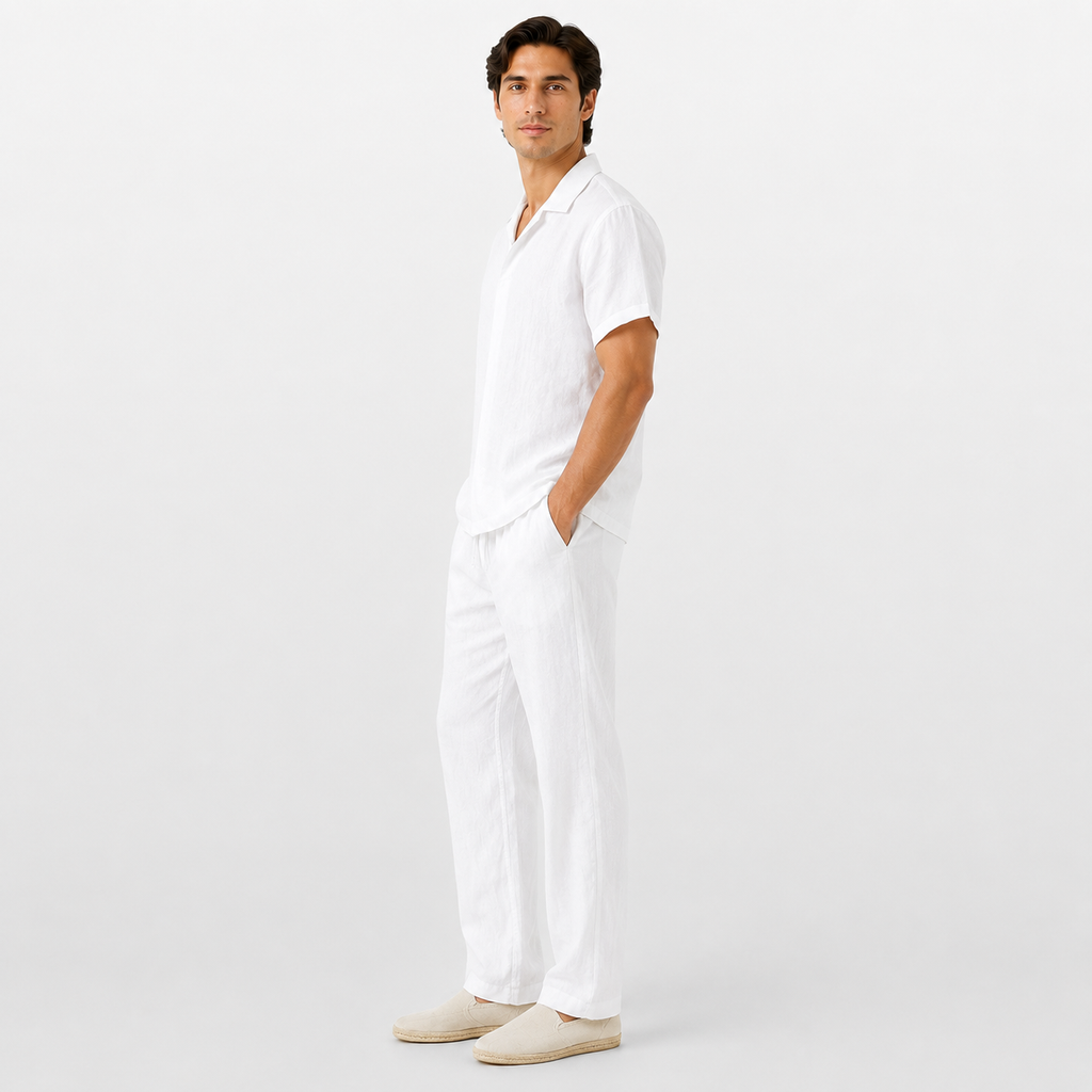 Man wearing a white outfit on a plain background