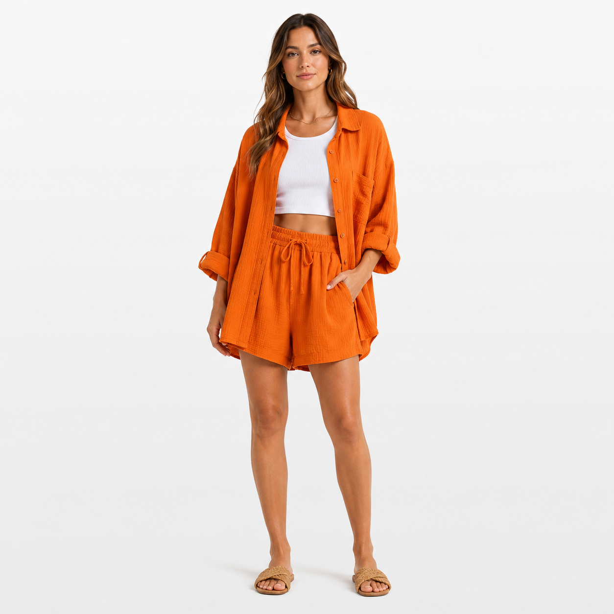 Woman wearing an orange outfit with a white background