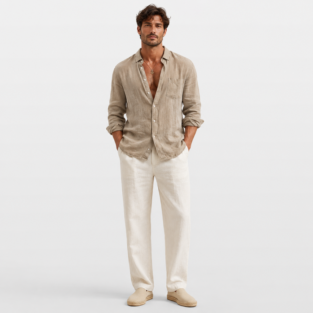 Man wearing a beige linen shirt and white pants on a light gray background