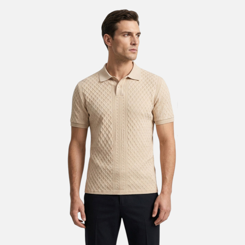 Man wearing a beige patterned polo shirt on a white background