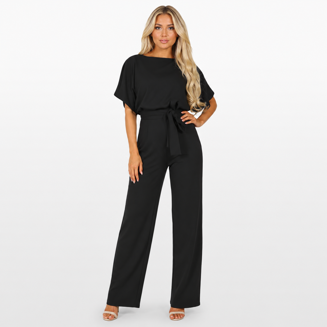 Woman wearing a black jumpsuit on a white background