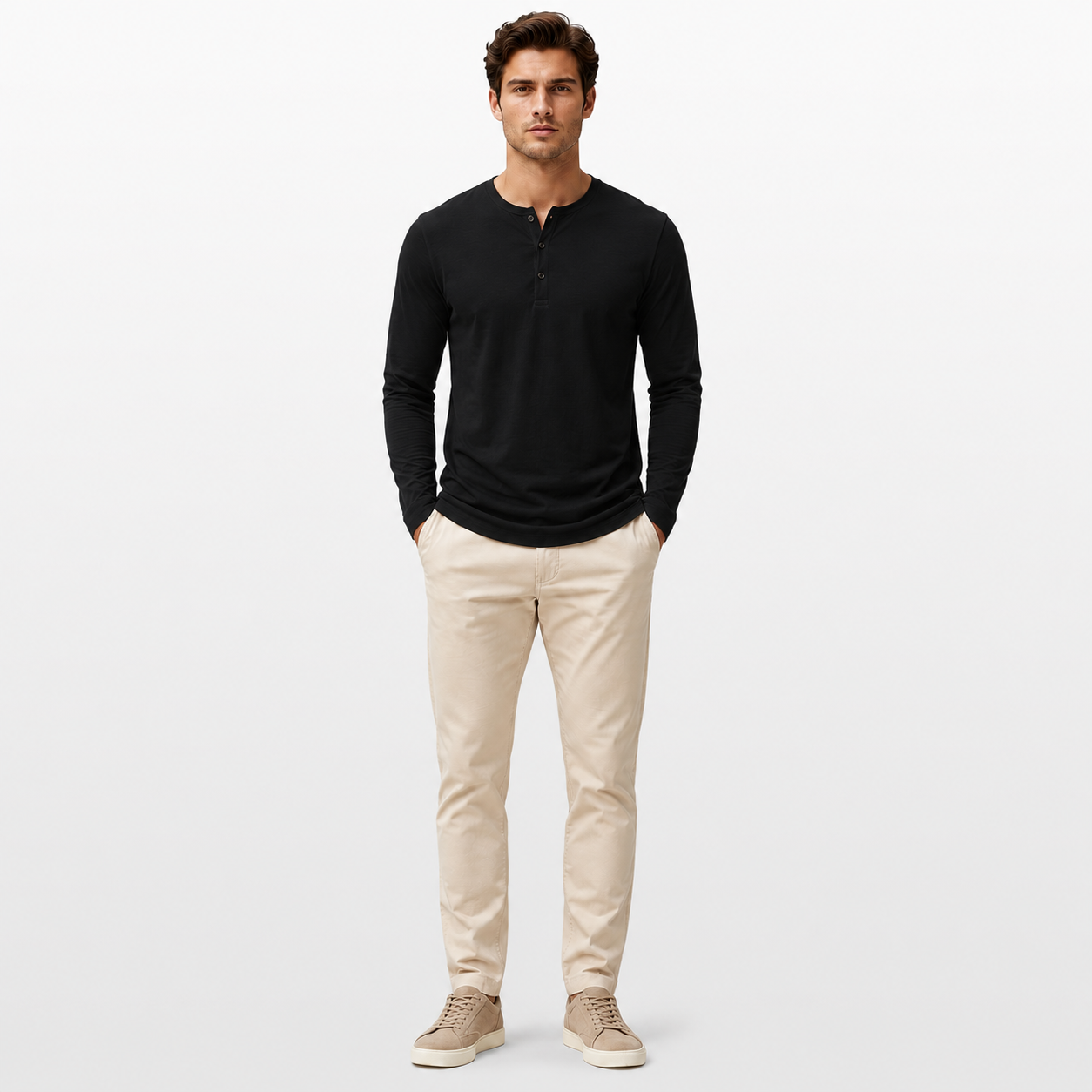Man wearing a black long-sleeve shirt and beige pants on a white background