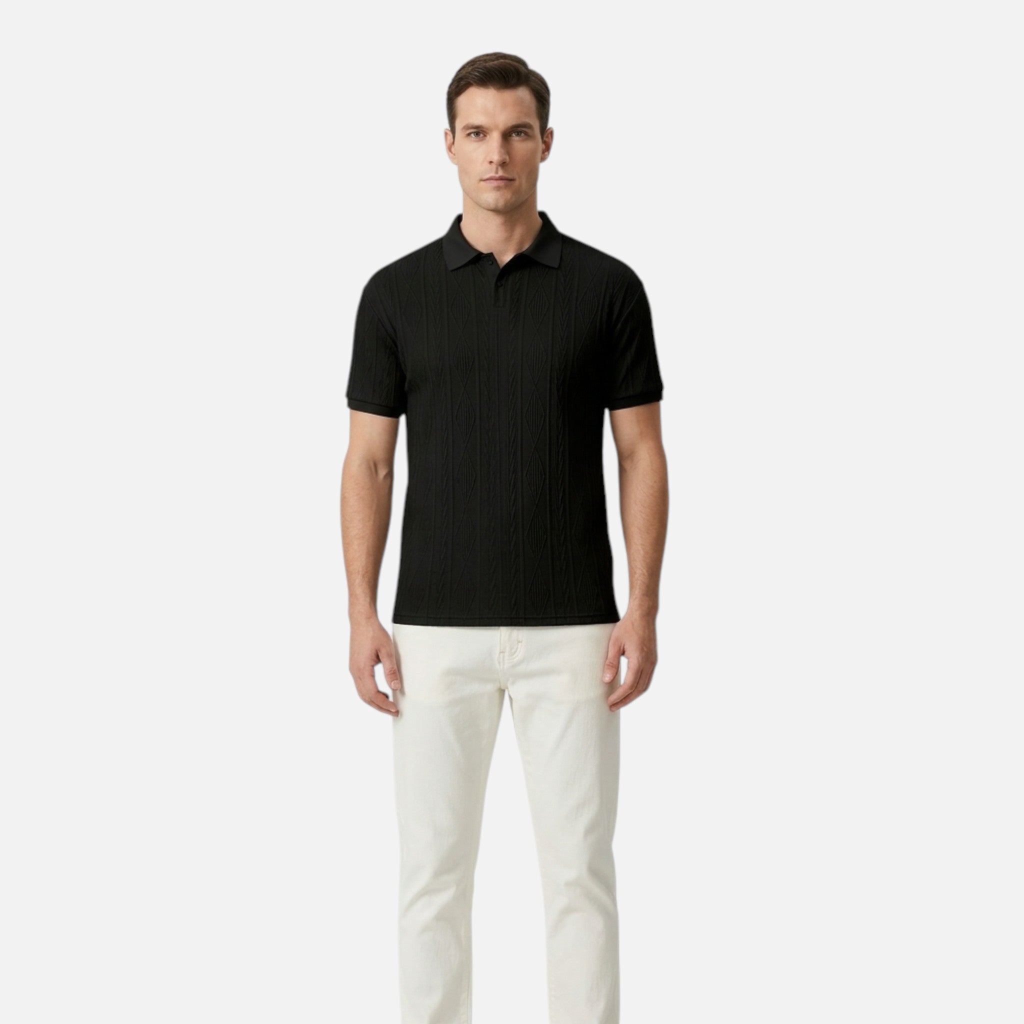 Man wearing a black polo shirt and white pants on a light gray background