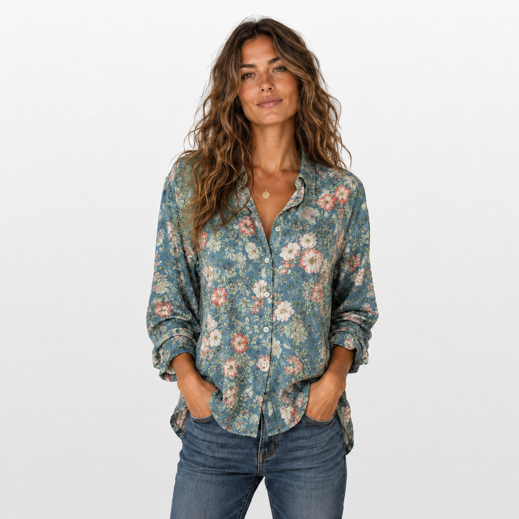Woman wearing a floral shirt and jeans on a white background