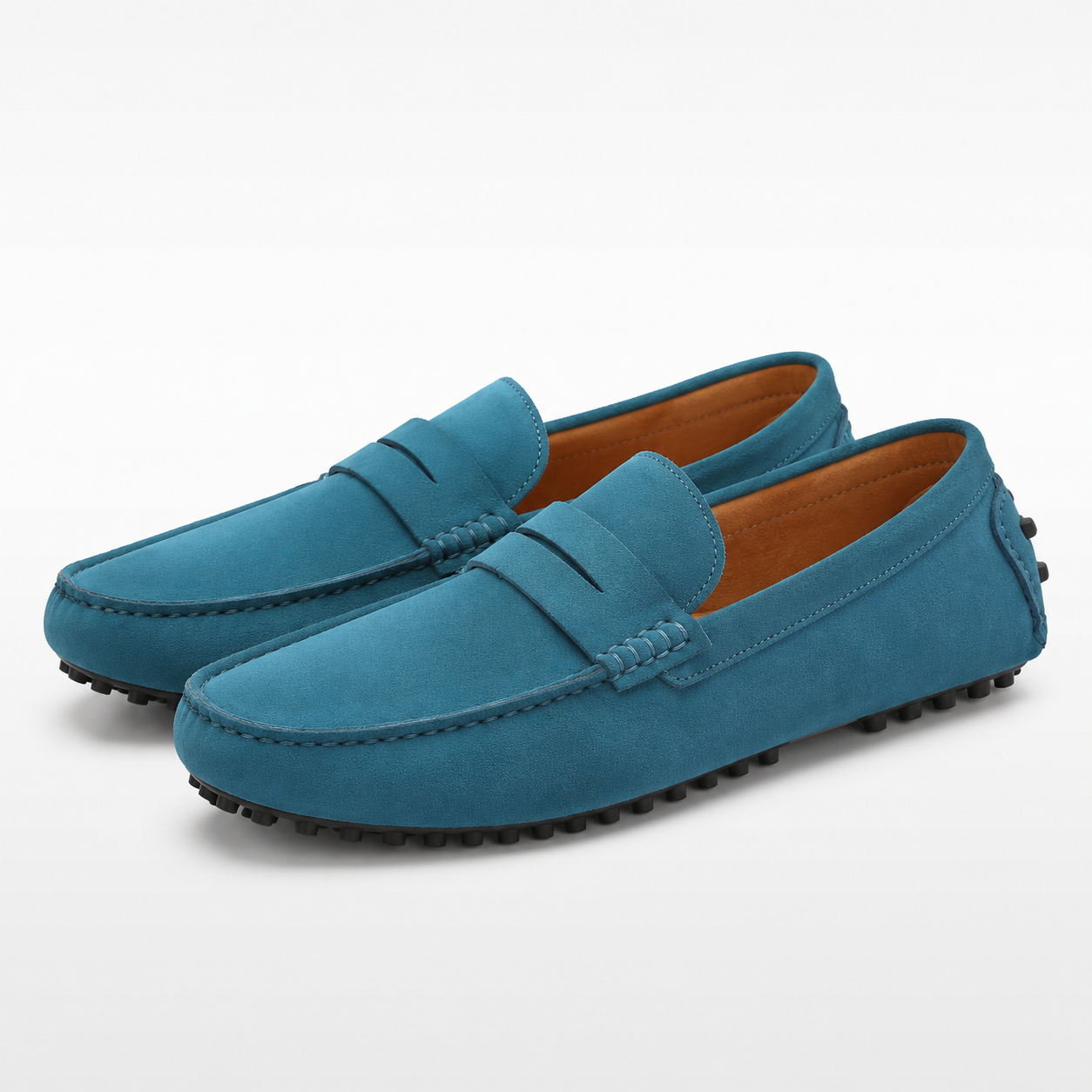 Pair of blue loafers on a white background