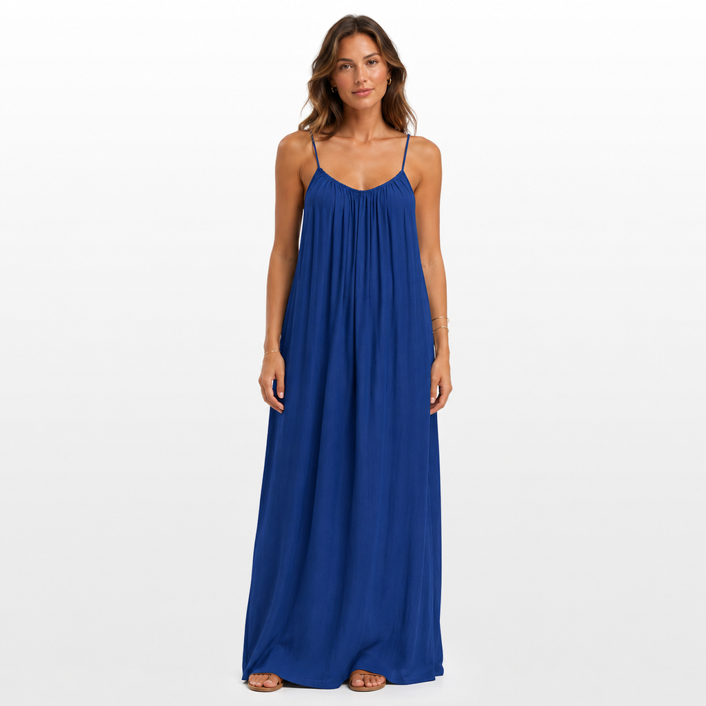 Woman wearing a blue maxi dress on a white background