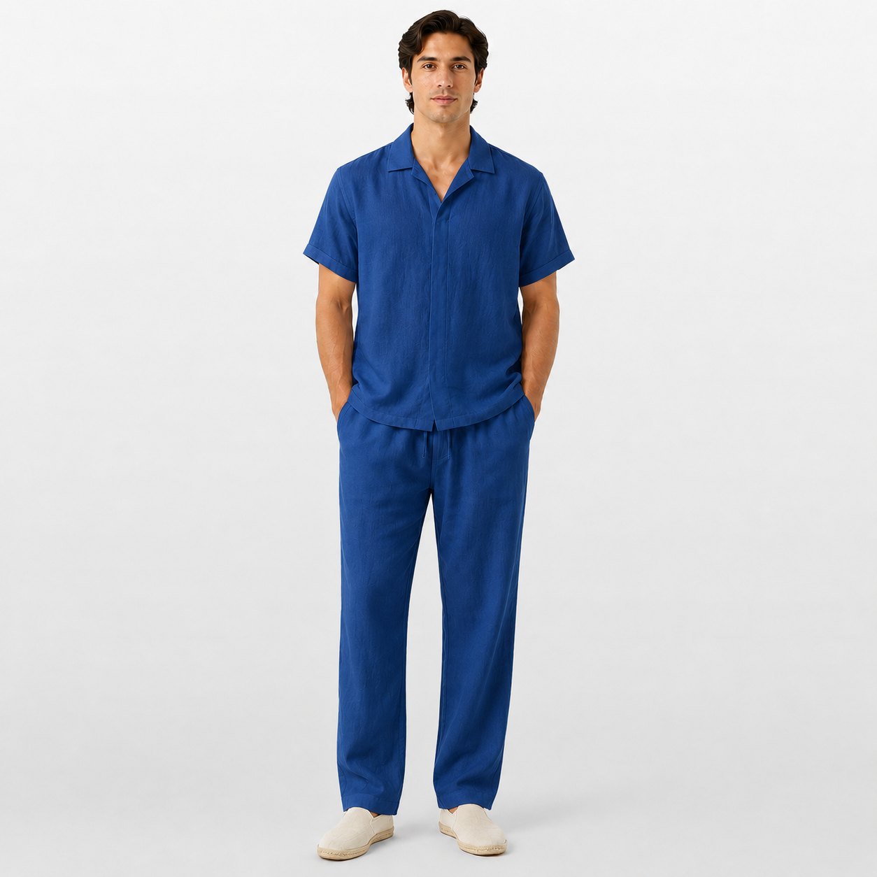 Man wearing a blue outfit on a white background