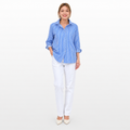 Woman wearing a blue striped shirt and white pants on a white background