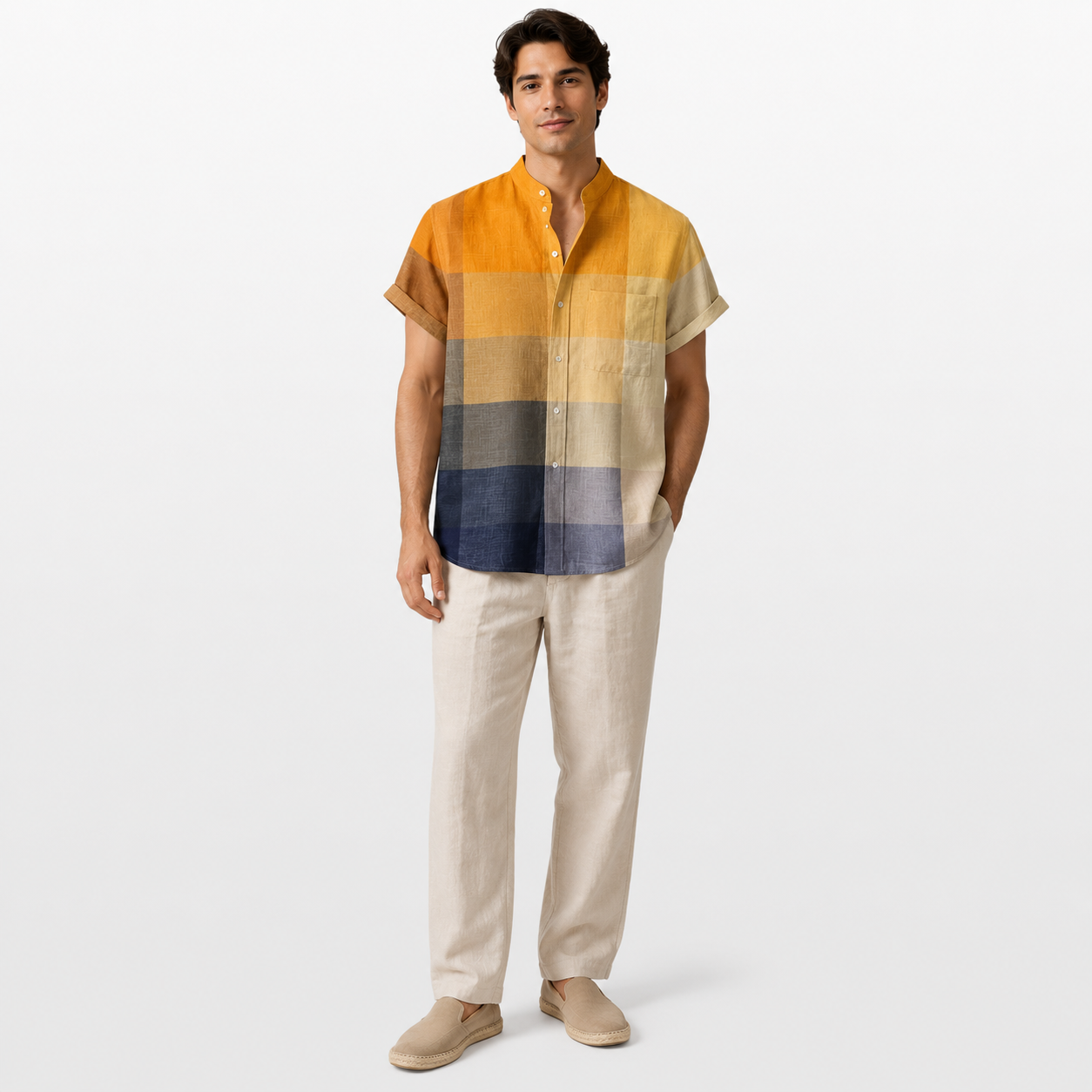 Man wearing a colorful striped shirt and beige pants on a white background
