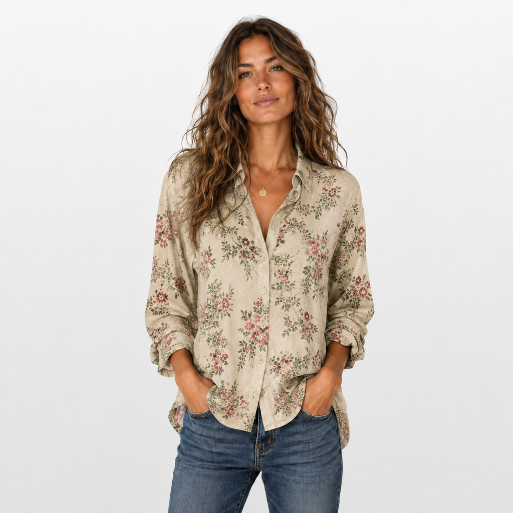 Woman wearing a floral blouse and jeans on a white background