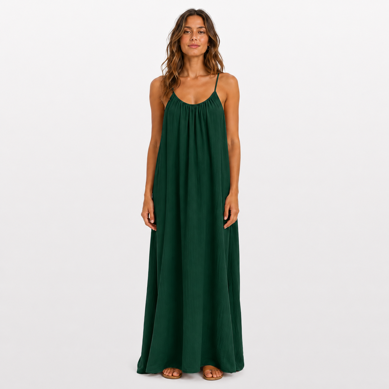 Woman wearing a green dress on a white background