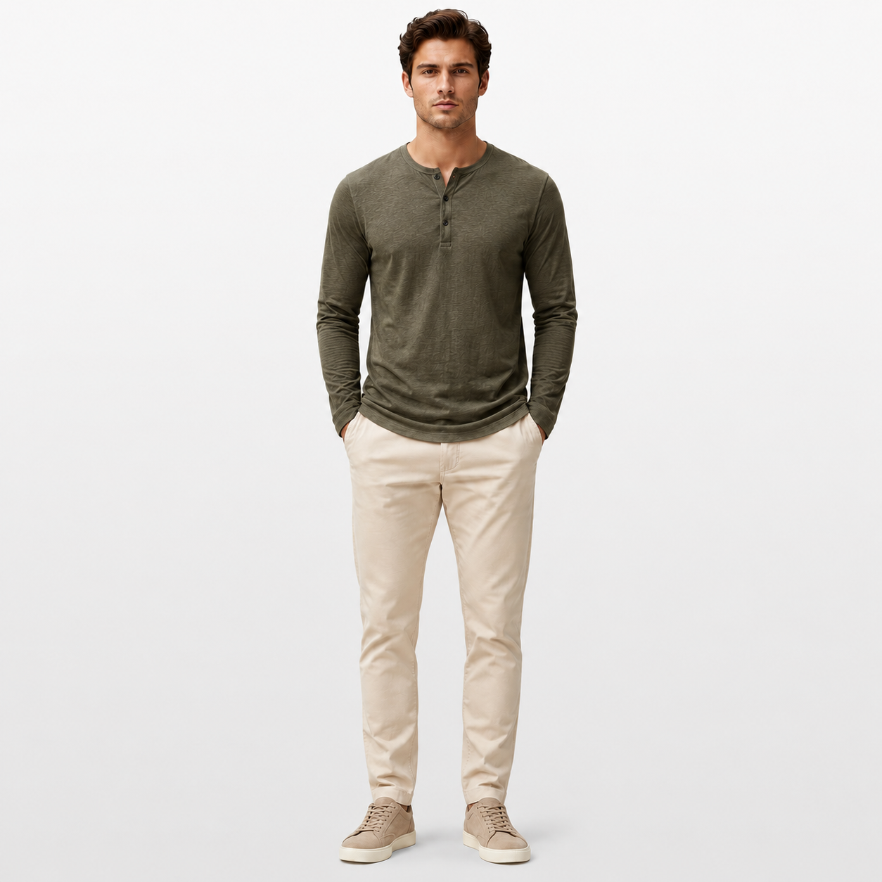 Man wearing a green long-sleeve shirt and beige pants on a white background