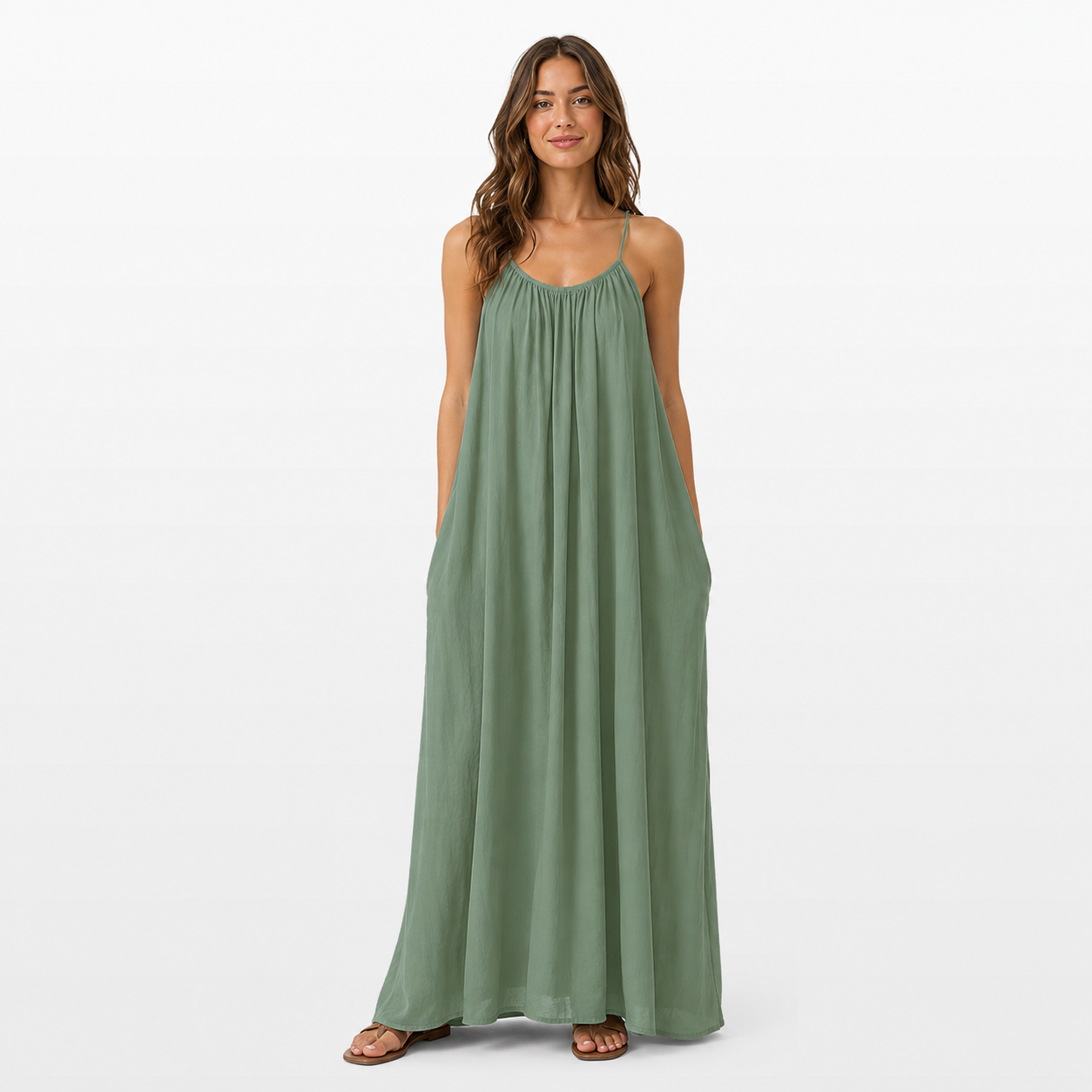 Woman wearing a green maxi dress on a white background