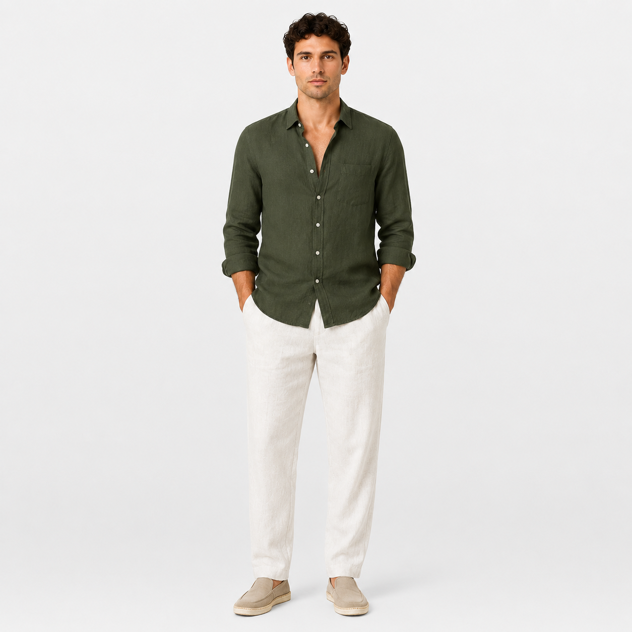 Man wearing a green shirt and white pants on a white background