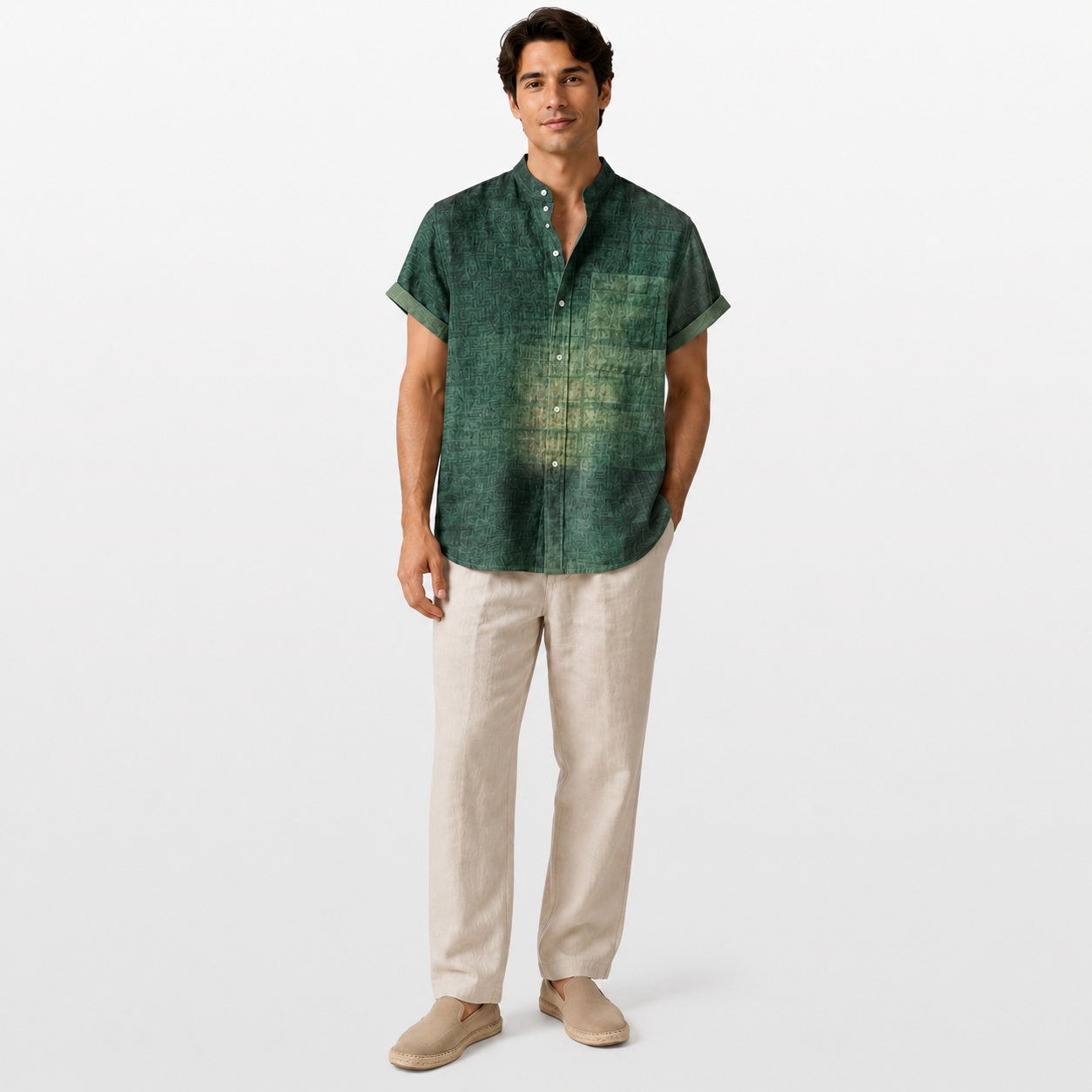 Man wearing a green short-sleeve shirt and beige pants on a white background