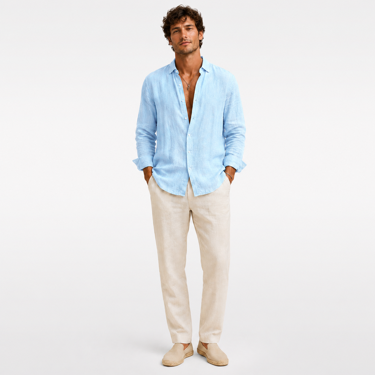 Man wearing a light blue shirt and beige pants on a white background