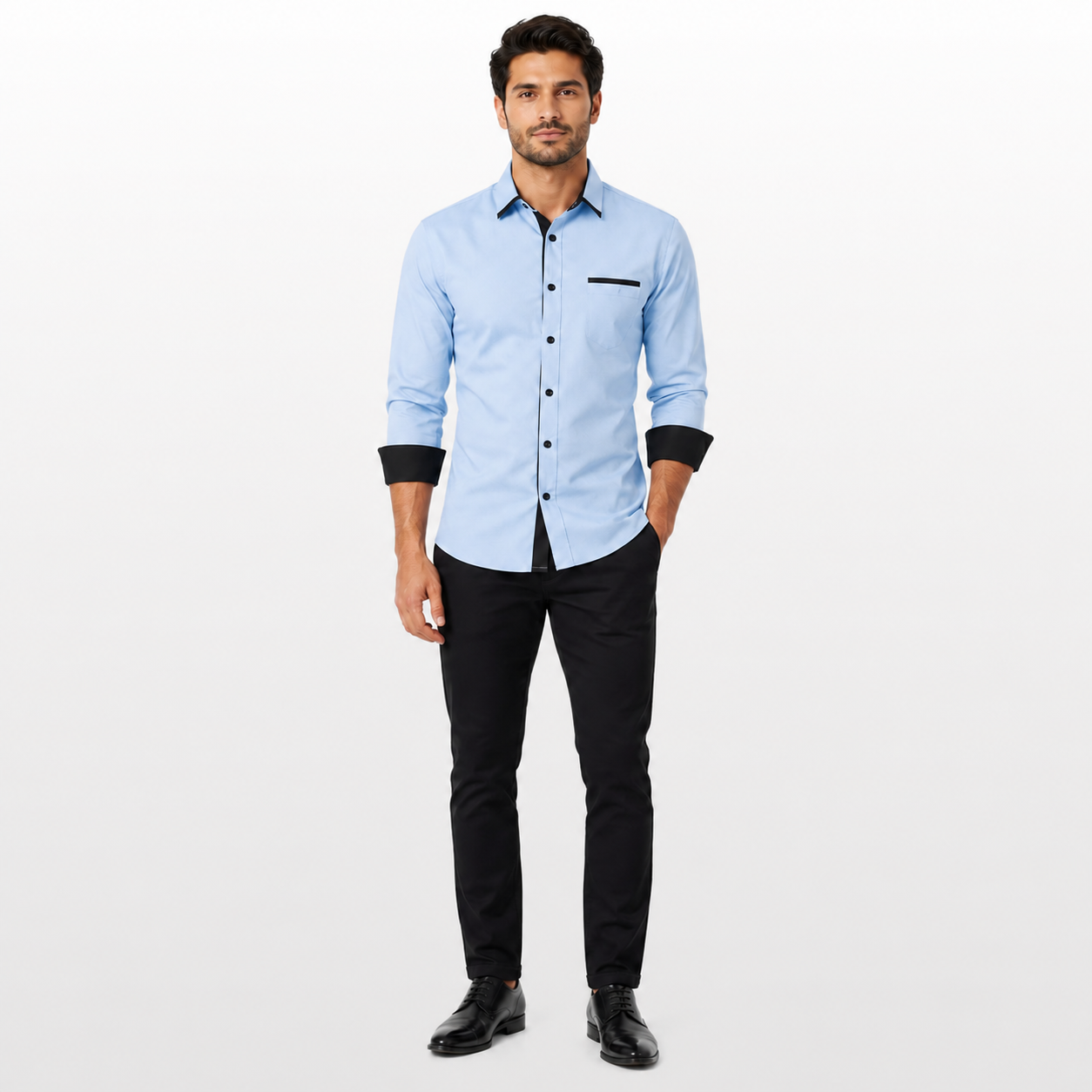 Man wearing a light blue shirt with black accents and black pants on a white background