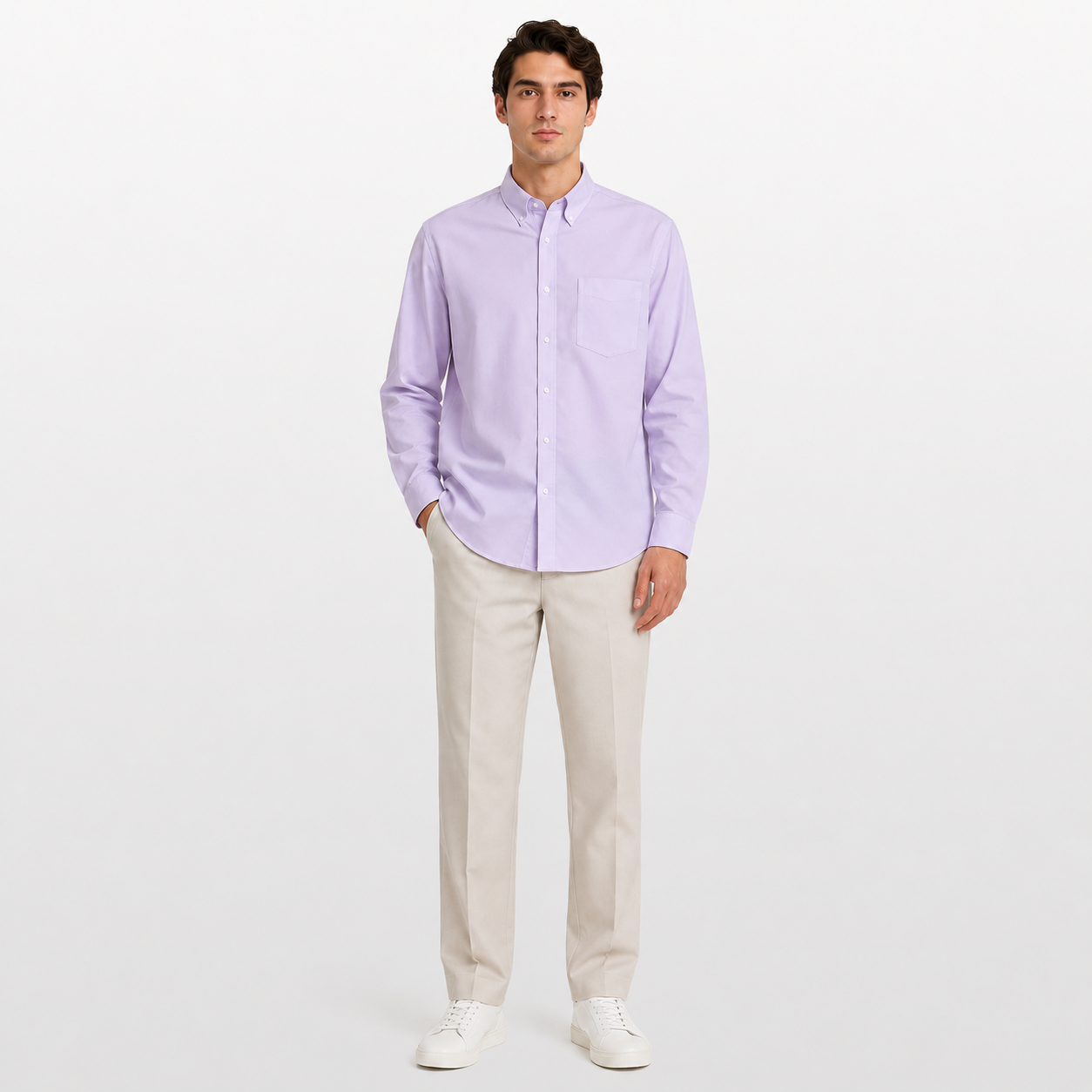 Man wearing a light purple button-up shirt and beige pants on a white background