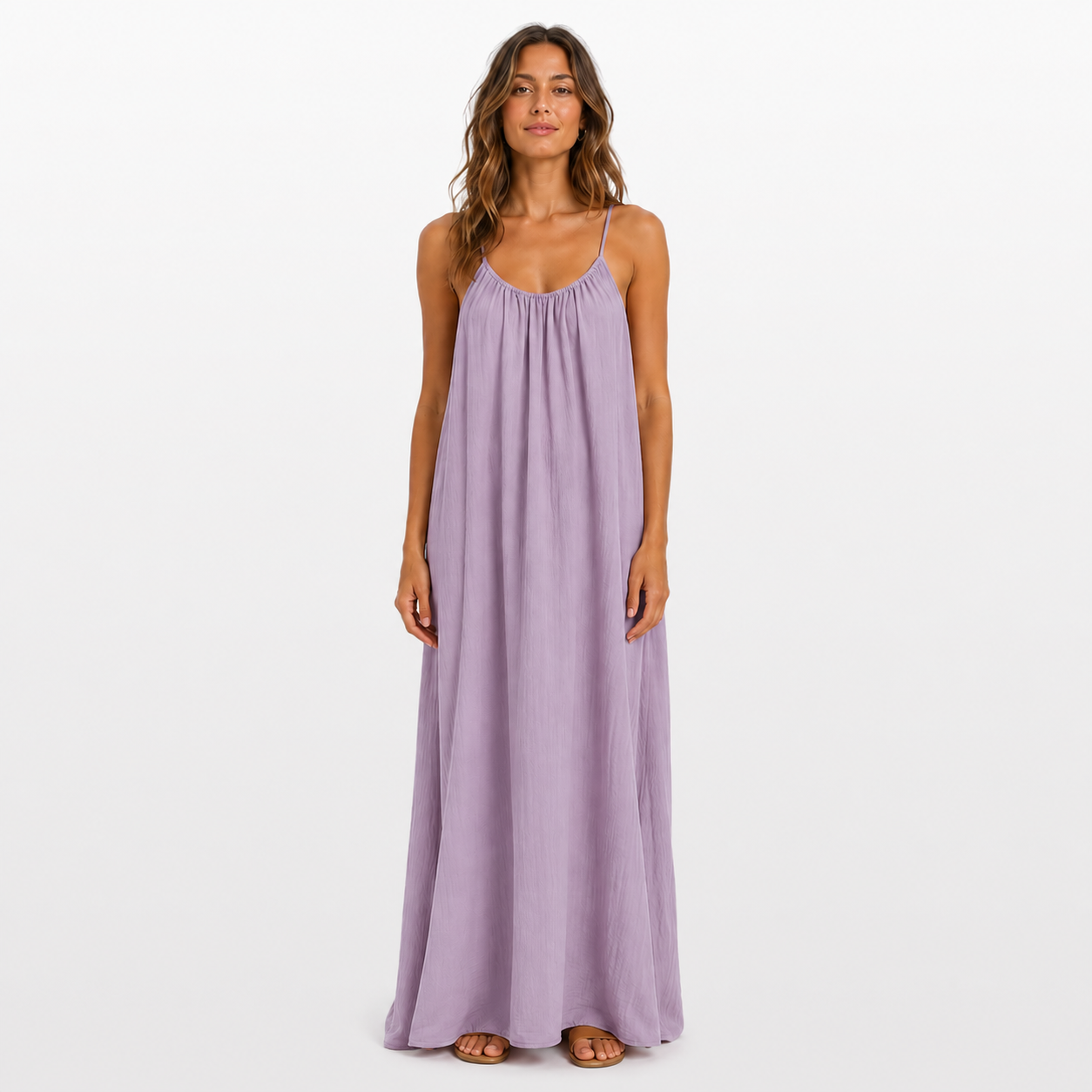 Woman wearing a long purple dress on a white background